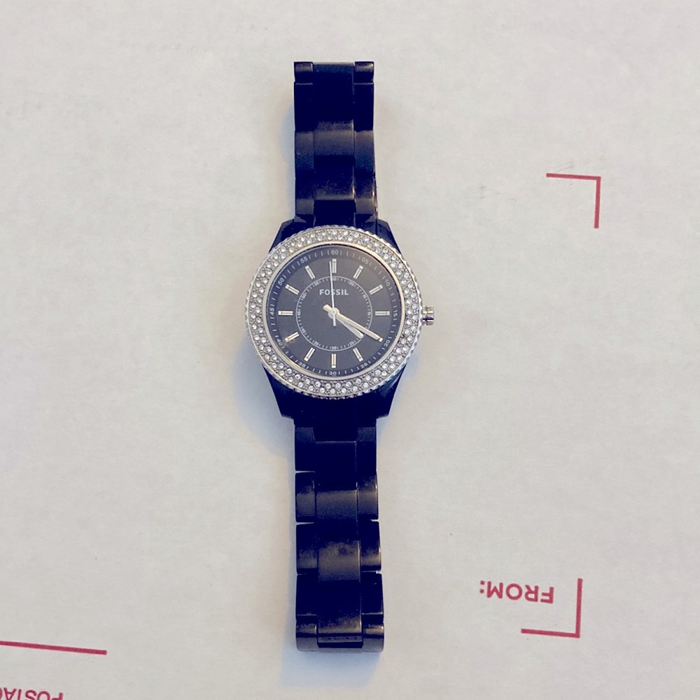 Women’s black chain link fossil watch with faux diamonds.